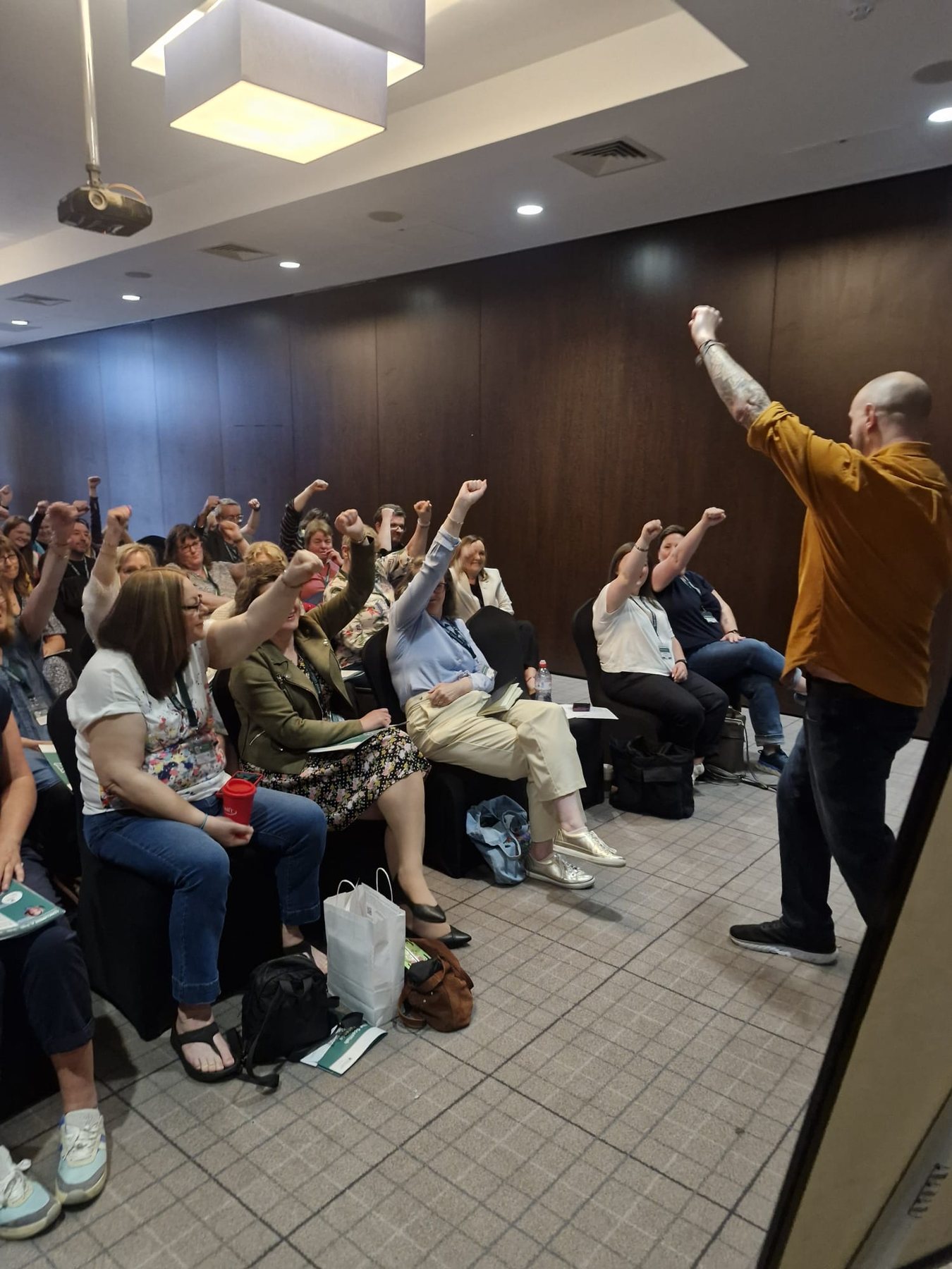 Speaker leading an audience participation moment